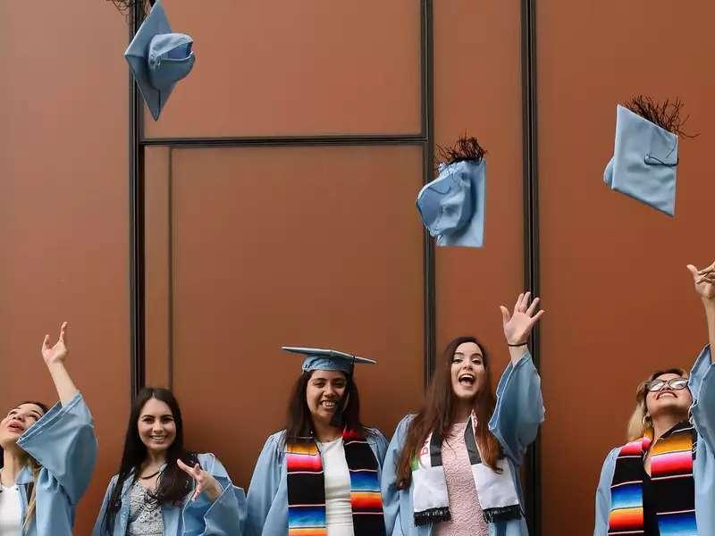 Grads throwing caps